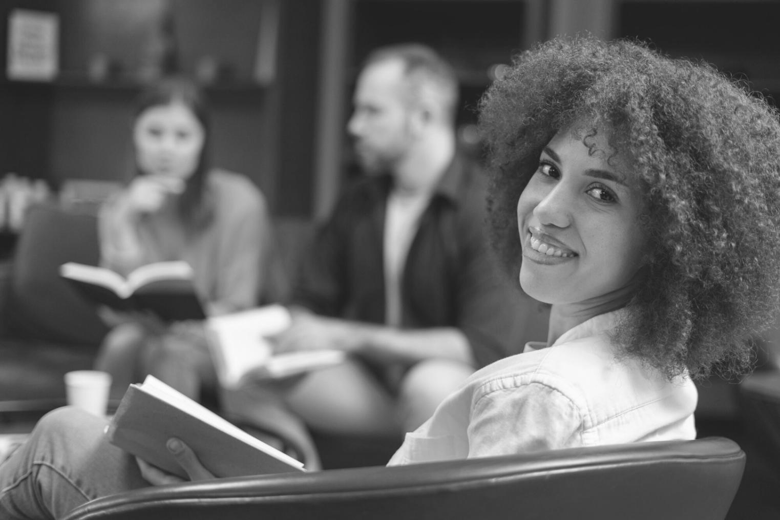 Financial analysis workspace with laptop and documents showing business metrics