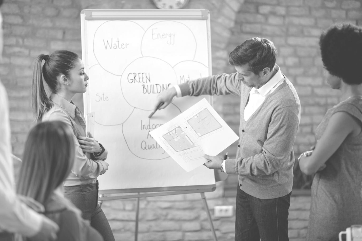 Business planning session with financial charts and strategic documents